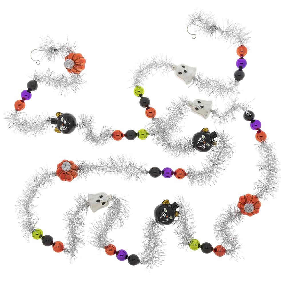 Garland/Trim Description - Halloween 1 Count 7' Tinsel Garland: Glass pumpkins, ghosts, black cats and miniature baubles in classic Halloween colors add spooky flair to this decorative tinsel garland.