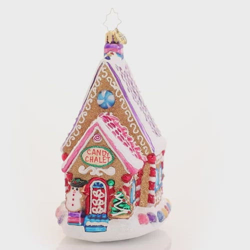 Video - Ornament Description - The Confectioner's Chalet: Nestled right on Candy Cane Lane, this gingerbread house is confection perfection! Rumor has it, it is home to the town candymaker--no wonder it is so sweet! This video shows the ornament spinning slowly. 