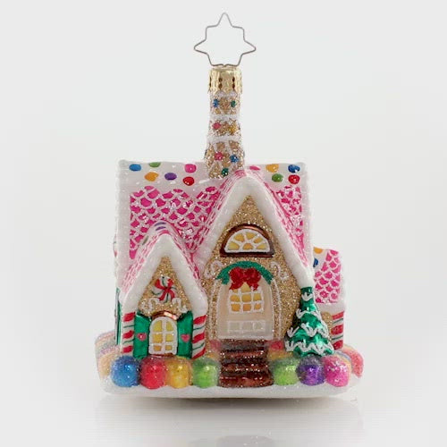 Video - Ornament Description - A Delectable Dwelling Gem: Goody goody gumdrops! Adorned with sweetness on all sides, this itty-bitty gingerbread cottage is total candy-covered confection perfection.