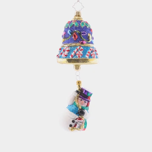Video - Ornament Description - Frosty Ringer: Dangling delicately from a beautiful blue Christmas bell, this little snow friend is ready to ring in Christmas! Adorned with colorful lights and candycanes, this piece is truly a treat to behold. This video shows the ornament slowly spinning. 