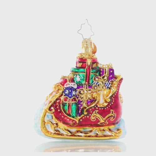 Video - Ornament Description - Regally Radiant Sleigh Gem: Santa's sleigh is packed to the brim with Christmas gifts for good girls and boys. Here's hoping we're on the nice list! This video shows the ornament spinning slowly. 