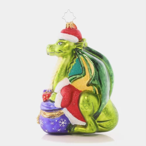 Video - Ornament Description - Fire-Breathing Friend: Never fear, this majestic green dragon is only here to spread Christmas cheer! He's an absolutely resplendant reptile in a red coat and festive Santa hat.