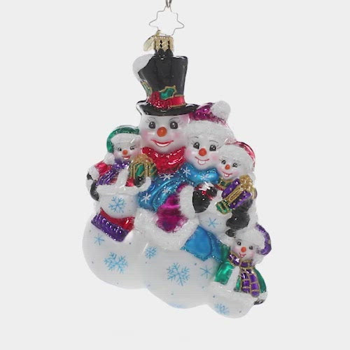 Video - Ornament Description - The Frosty Family: They may be made of snow, but these frosty folks know the warmth of a family! They snuggle together for a group hug before joining their friends for some winter fun. This video shows the ornament spinning slowly. 