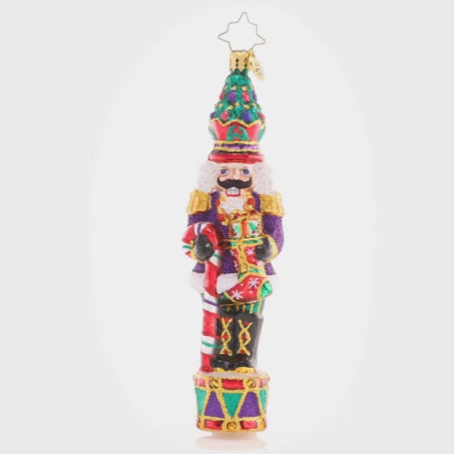Video - Ornament Description - Christmas Commander Nutcracker: Complete with a Christmas tree crown, this nutcracker is truly a commanding presence! He's ready to make this holiday the best one yet with a candy cane staff and plenty of gifts..