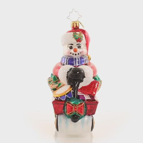 Video - Ornament Description - Wheelin' And Dealin' Snowman: Look at Frosty go! He is wheel-y excited for Christmas and is thumpity-thumping through town in his little red wagon. We hope he got insurance! This video shows the ornament spinning slowly, 