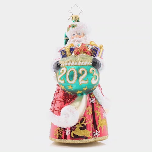 Video - Ornament Description - New Year Nice List: St. Nick spreads kindness and cheer throughout the year. Stepping into 2023 with a crimson coat adorned with golden deer! This video shows the ornament spinning slowly. 