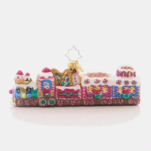 Video - Ornament Description - Sweet Treat Express: All aboard the candy-covered choo choo train! Glistening with gumdrops, peppermints, and radiant-white royal icing, this sweet ride is the perfect transport to your holiday destination. This video shows the ornament spinning slowly. 