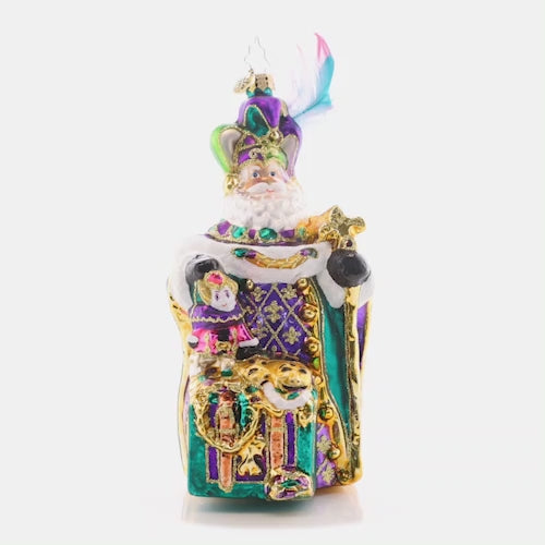 Video - Ornament Description - Mardi Gras Claus: Santa is donning his festive feathered hat and traditonal Fleur de Lis, celebrating Christmas with a magical Mardi Gras flair. This video shows the ornament spinning slowly. 
