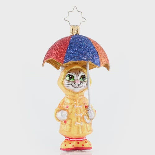 Video - Ornament Description - It's Raining Cats! Gem: This itty bitty kitty has the right idea for staying dry when it is really coming down. Got to love that drizzly-day fashion! This video shows the ornament slowly spinning. 