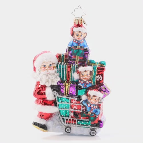 Video - Ornament Description - Savvy Shopper Santa: Santa says it's time to shop 'til you drop! With the assistance of his elf helpers, he's picking up the season's best tidings to deliver this Christmas. This video shows the ornament spinning slowly. 