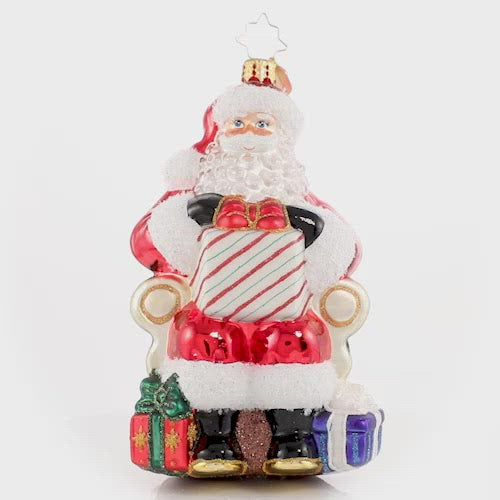 Video - Ornament Description - Santa's Lap of Luxury: Santa relaxes on his signature velvet chair, ready to hear the wishes of countless good little boys and girls. Naughty or nice, Santa always delivers! This video shows the ornament spinning slowly. 