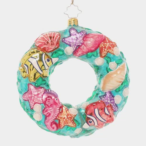 Video - Ornament Description - Under The Sea Wreath: A coral reef comes alive with this ocean-themed wreath ornament! Brightly colored fish, starfish and seashells swirl together to remind us of the unique beauty of the tropical seas. This video shows the ornament spinning slowly. 