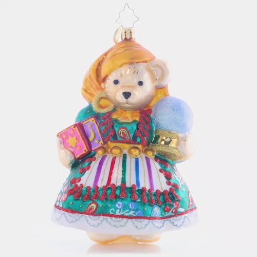 Video - Ornament Description - Muffy's Fortune: Would you allow Muffy to read your future? That's the question with our beautiful Muffy ornament bedecked in all her most glamourous Fortune-teller Fashion. With all the detail of her gorgeous gown, apron, headwrap, and ear hoops, the New Year looks bright and promising! This video shows the ornament spinning slowly. 