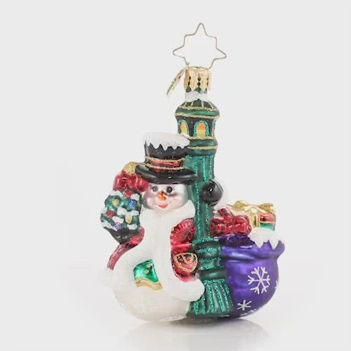 Video - Ornament Description - Swinging In The Rain Gem: Everyone's favorite snowman is turning heads in town. Each light pole that he passes, he cannot resist a little swing around! This video shows the ornament spinning slowly. 