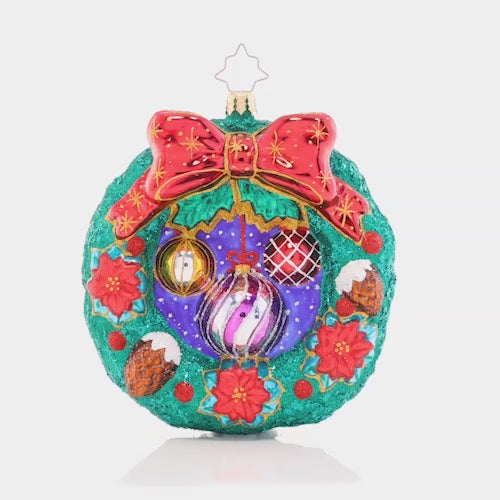 Video - Ornament Description - Christmas Cheer Wreath: Decked out with darling ornaments, snow-covered acorns, and ruby-red poinsettias, this wreath is chock-full of Christmas cheer! Decorate your tree with this classic holiday piece.