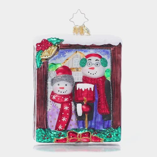 Video - Ornament Description - A Moment in Time: Say cheese! This snow couple gives us their chillier--and cheerier!-- version of the iconic American Gothic painting.