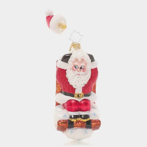 Video - Ornament Description - Hats Off Sledding Santa: Hold on to your hat! This whimsical Santa has been speeding down the slopes on his sled so fast that his hat is getting left behind! This video shows the ornament slowly spinning. 