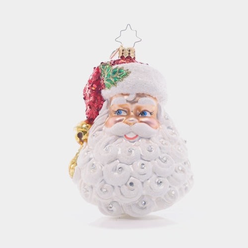 Video - Ornament Description - Sparkling Saint Nick: With a bell-tipped Santa hat adorned with radiant ruby-red glitter, this sweet St. Nick is looking his absolute best this holiday season. This video shows the ornament spinning slowly. 