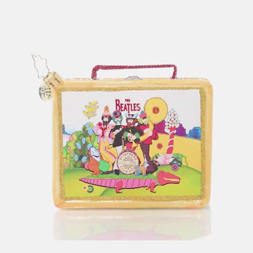 Video - Ornament Description - Let's Do Lunch: Fashioned after the classic tin lunch boxes of yesteryear and featuring colorful scenes from Yellow Submarine, this playful piece packs a powerful punch of nostalgia. Is it lunchtime yet? This video shows the ornament slowly spinning. 