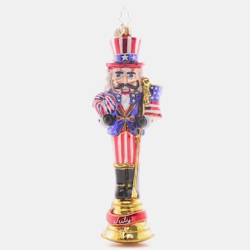 Video - Ornament Description - Fireworks For The Fourth: Celebrate the land of the free with this patriotic nutcracker! The seventh piece in our Ornament of the month collection proudly sports a festive suit of red, white, and blue.