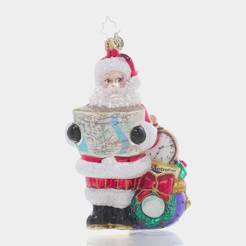Video - Ornament Description - MTA Saves the Day: Santa has arrived in the Big Apple, but is without his trusty reindeer to guide the way. Luckily he can count on the MTA to help him navigate the city and make sure his special deliveries arrive safely and right on time! This video shows the ornament spinning slowly. 