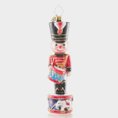 Video - Ornament Description - Cheerful Toy Solider: A-ten-hut! Dressed in a holiday red coat and shiny black boots, this smiling soldier grins from his post atop a Christmas drum.