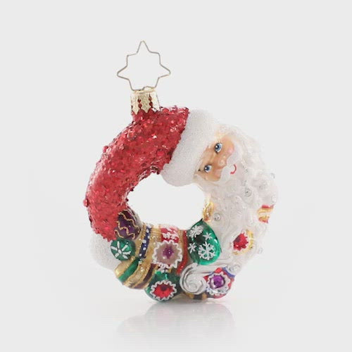 Video - Ornament Description - Santa Comes Full Circle Wreath Gem: Give love, get loveâ€¦no one knows this full circle of the season better than good old Saint Nick. This stunning miniature wreath includes Santa himself and some of the prized ornaments from his collection. This video shows the ornament spinning slowly 