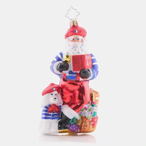 Video - Ornament Description - Pardon My French Santa: Bon jour, Santa Claus! This Santa is looking perfectly posh and Parisian, complete with a bundle of baguettes and a poodle puppy. Joyeux Noel, indeed! This video shows the ornament slowly spinning. 