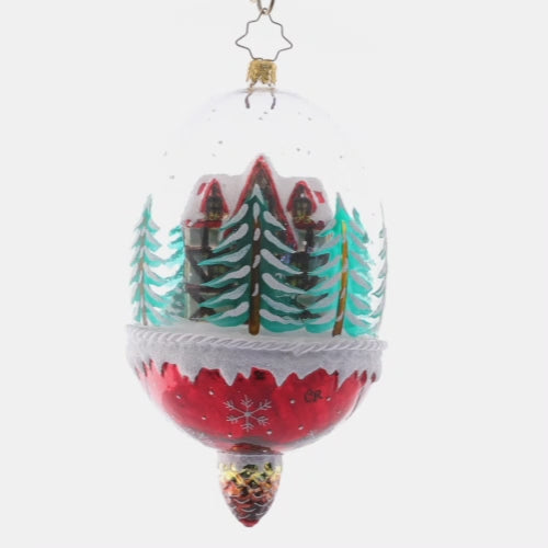 Video - Ornament Description - Winter Cottage Hideaway: Ensconced within a snow-filled dome, this cozy chalet surrounded by pine trees makes for a stunning winter scene. This special ornament has been hand-picked by the Radko team to be part of the Limited Edition collection.