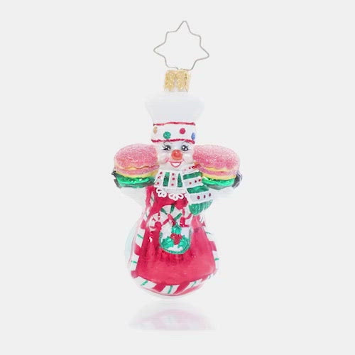 Video - Ornament Description - This Christmas Takes The Cake Gem: A jolly snowman baker shows off his tasty holiday treats fresh from the oven. Come and get it! This video shows the ornament spinning slowly. 