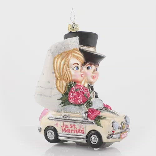 Video - Ornament Description - Riding Merrily in Matrimony: Just Married! These newlyweds are off to their honeymoon in style--we send out best wishes to the new Mr. and Mrs.! This video shows the ornament spinning slowly. 