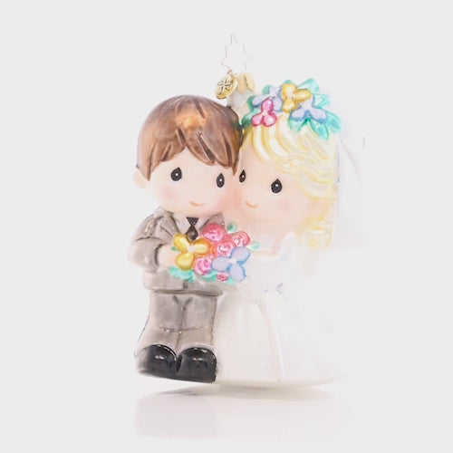 Video - Ornament Description - Precious Newlyweds: They do! Celebrate the happy couple in your life with this darling bride and groom. The perfect addition to your Precious Moments collection, this keepsake piece evokes the sweetness of love and the beginning of a new life together. This video shows the ornament slowly spinning.