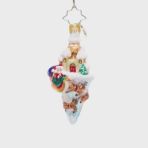 Video - Ornament Description - Paradise On Ice Gem: North Pole on ice! This detailed little ornament shows off all of the best parts of the North Pole; Saint Nick and his sleigh, flying reindeer, the warm glow of Santa's workshop, and of course lots of snowy scenery. This video shows the ornament slowly spinning. 