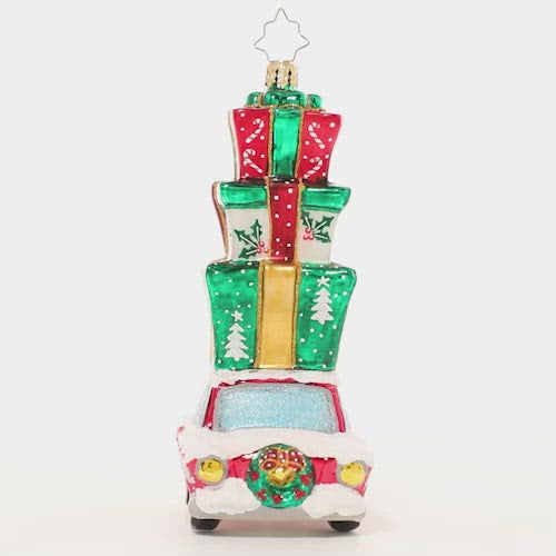 Video - Ornament Description - Holiday Driver: Beep beep! Here comes Christmas! This classic car is piled high with presents, ready to surprise and delight. This video shows the ornament slowly spinning. 