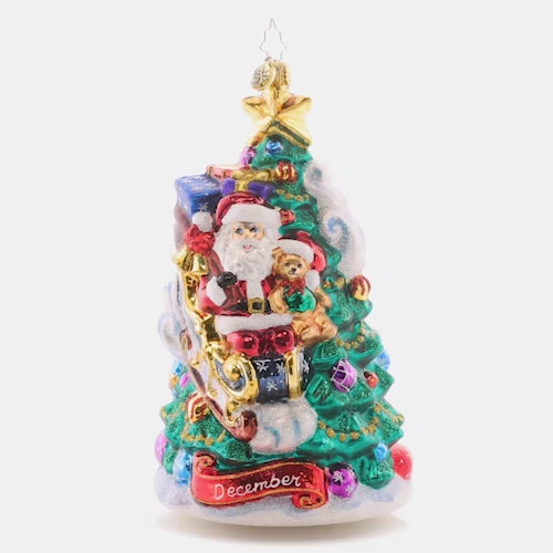 Video - Ornament Description - December Decadence: What a wonderous time of the year! Christmas is finally here, and Santa touches down on the trimmed tree to deliver presents just in time. The final piece of our Ornament of the Month collection celebrates the magic of Christmas! The video shows the ornament slowly spinning. 