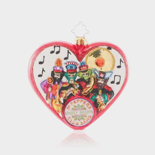 Video - Ornament Description - We're With The Band: We all get by with a little help from our friends-- John, Paul, George, and Ringo of course! The band is at it again to ring in Christmas with this playful ornament. No Lonely Hearts here! This video shows the ornament spinning slowly. 