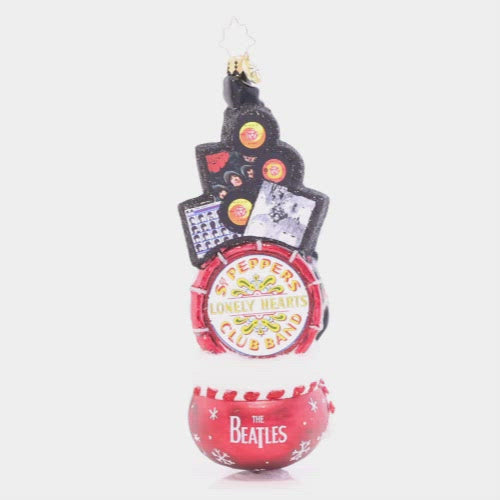 Video - Ornament Description - Beatles Greatest Gifts: Looks like you've been extra good this year, so Santa has brought you a sack bursting with Beatles goodies. From Sgt. Pepper's drum to your favorite Beatles albums-- it's every Beatle collector's dream.