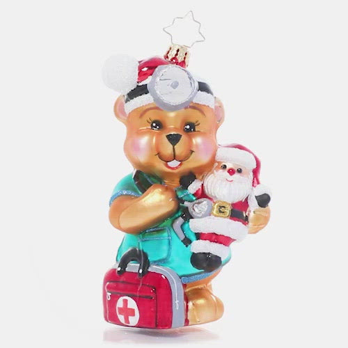Video - Ornament Description - The Doctor is In: Dr. Teddy is ready to see (and snuggle!) some patients! He believes that love is the best medicine and wants to share encouragement and cheer with the sick children who need him most. A percentage of the sales from this ornament will benefit Pediatric Cancer charities. This video shows ornament spinning slowly. 