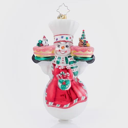 Video - Ornament Description - This Christmas Takes The Cake!: Mr. Snowman has been hard at work in his magical bakery, whipping up all types of sweets as the holidays draw near. These Christmas cakes are sure to fly off the shelves--no one can resist his frosty treats! This video shows the ornament spinning slowly. 