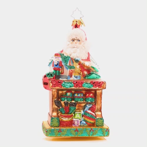 Video - Ornament Description - Working Overtime: Santa is putting in extra hours in his North Pole workshop to make sure every toy is in tip-top shape. He's crafting Christmas joy with each piece he builds! This video shows the ornament spinning slowly. 