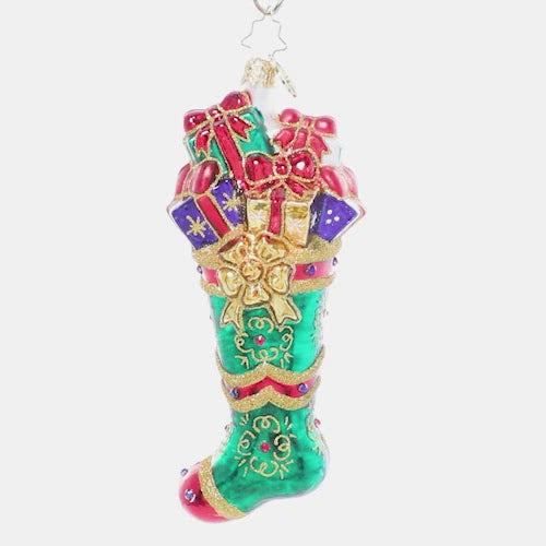 Video - Ornament Description - Splendid Stocking: Someone has been extra good this year! An emerald green stocking has been stuffed full of goodies to delight and thrill on Christmas morning. This video shows the ornament spinning slowly. 