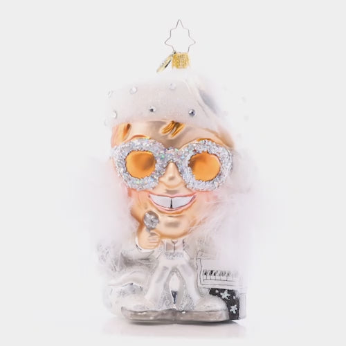 Video - Ornament Description - Holiday "Star": The Legend- nobody eclipses his stardom! This radiant Elton John ornament embodies everything the world loves about our Rocket Man: Showmanship, talent, and music for the ages. He's ready to steal the show on your Christmas tree this year! This video shows the ornament slowly spinning. 