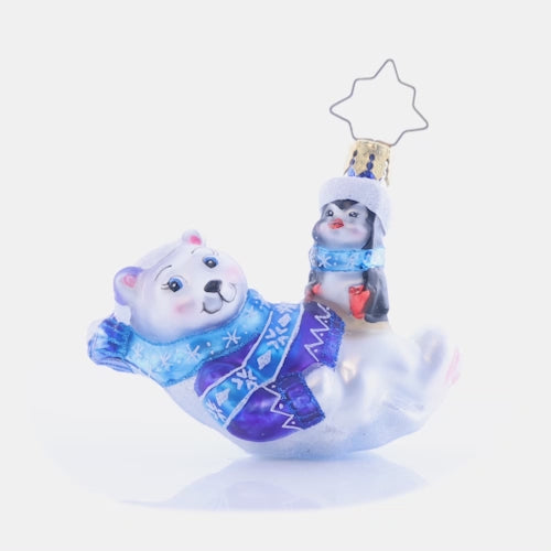 Video - Ornament Description - Perfect Polar Pals Gem: Laid-back and lounging in a snowflake-covered Christmas sweater and scarf, these polar bear and penguin pals are the definition of chill. This video shows the ornament spinning slowly. 