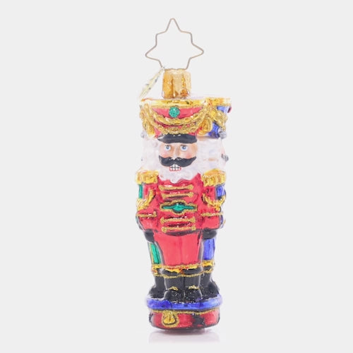 Video - Ornament Description - Three Nutty Knights Gem: Standing guard in red, blue, and green, these stylish and stoic nutcrackers have each other's backs – the perfect protectors for the gifts under your Christmas tree! This video shows the ornament spinning slowly. 
