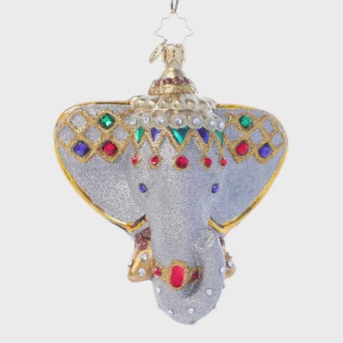 Video - Ornament Description - Opulent Elephant: Beckon the far east home with this stunning Indian elephant ornament. Adorned with bold jewels and rich gold, this elegant icon is said to bestow wisdom and good fortune to the home of all who possess it. This video shows the ornament spinning slowly. 