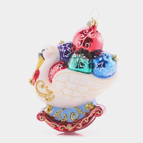Video - Ornament Description - Festive Feathers - 2023: What could be prettier than a festive swan who has gathered Christmas ornaments to flaunt among her feathers? This bird will compete with any tree for the best decorated, as you can see! This video shows the ornament slowly spinning.