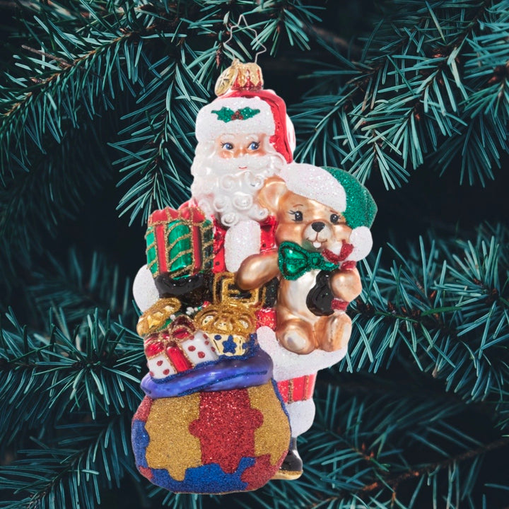 Ornament Design - Delivering Awareness: Santa's sack is packed with presents galore, spreading Christmas cheer and support for a cause close to his heart; Autism awareness. A percentage of the sales from this ornament will benefit a charity that raises Autism awareness.
