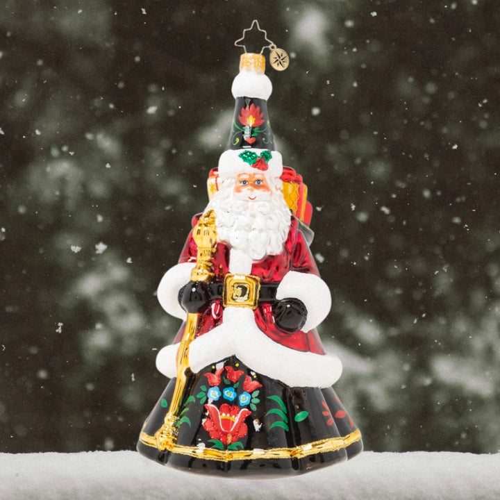 Ornament Description - Festive Folk Santa: Santa puts a twist on traditional in this cozy ensemble fashioned in the style of beautiful European folk art. Our Designer's Choice ornament of the year looks like he could have stepped straight out of a Christmas fairytale!