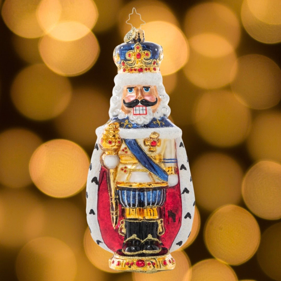 Ornament Description - Nutcracking Royalty: Get the holiday season cracking this year with this jolly royal nutcracker. From behind, his regal robe wraps around his feet giving him a shape reminiscent of a nut himself!