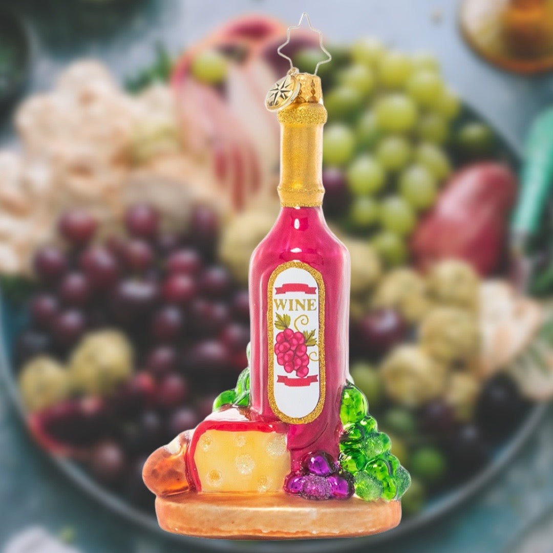 Ornament Description - Sophisticated Spread: Peace on earth, goodwill to men…we'll cheers to that! This festive ornament features all the fixings of a delicious gathering plate – bread, grapes, and of course, wine – perfect for any gourmand on your list.
